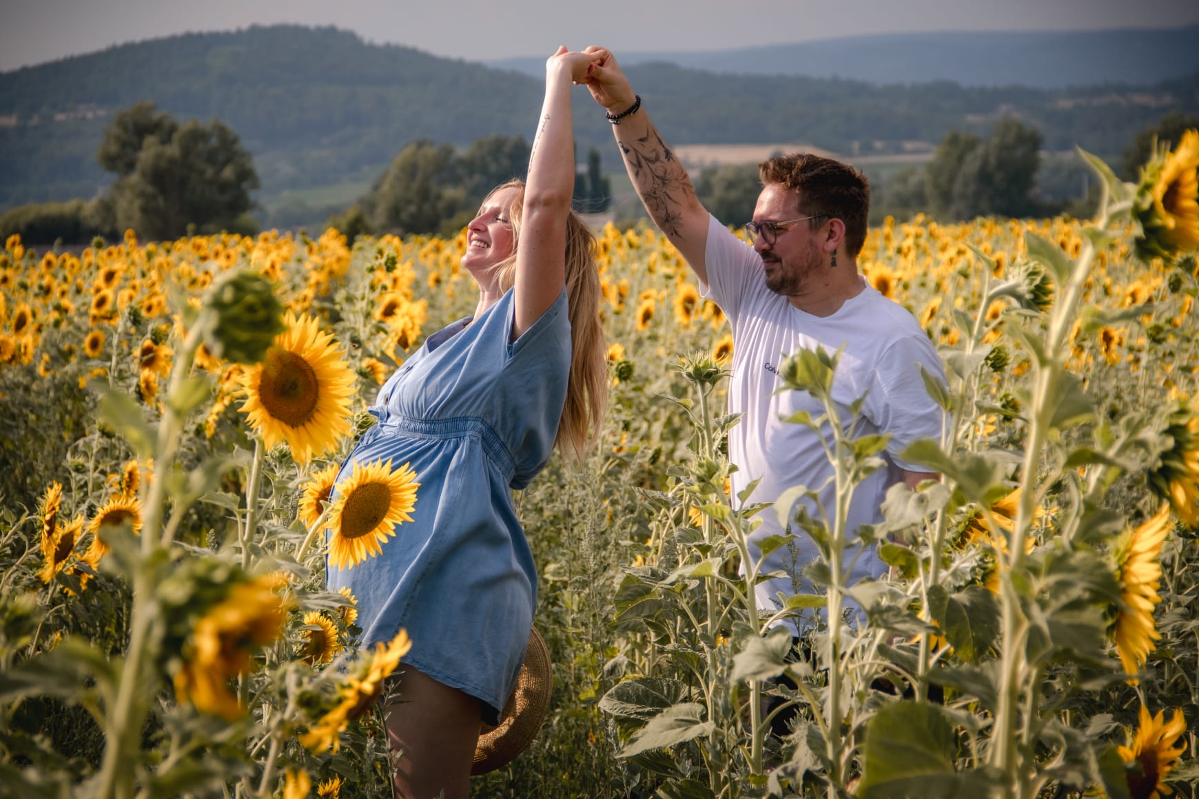 Couple dancing in a sunflower field, Provence